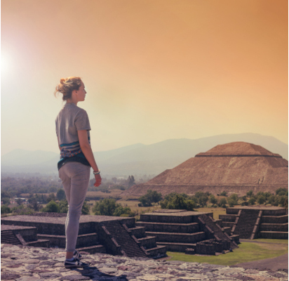 A woman looking amazed as she sees a historical place.