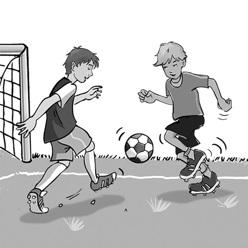 Two boys playing soccer.